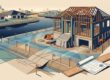 Partially built home on a raised foundation beside a canal with drainage swales and survey stakes.