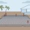 A concrete home foundation with reinforcement mesh, plumbing stubs, and palm trees nearby.